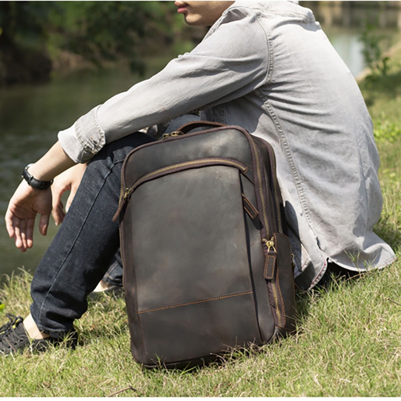 Outdoor Model Show of Woosir Leather Laptop Backpack with Trolley Sleeve and Double Compartments