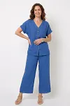 Front view of vibrant cobalt blue linen two-piece set featuring V-neck button-up top and layered wide-leg pants