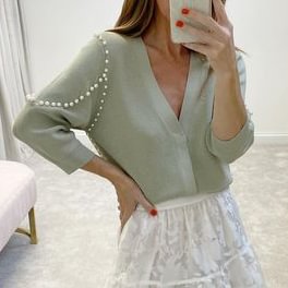 Knitted light green cardigan sweater