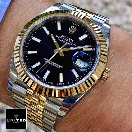 Rolex Datejust 126333 Black Dial Yellow Gold Replica on the man wrist