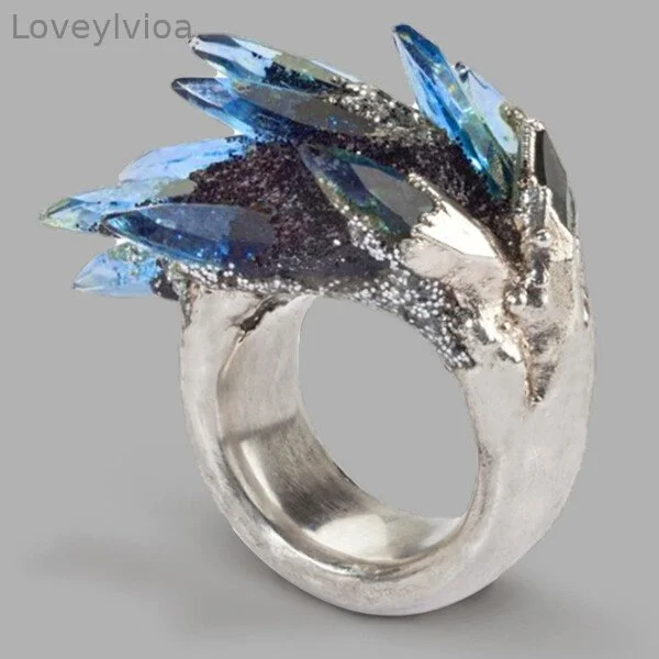 Blue Zircon Tilted Crystal Rings