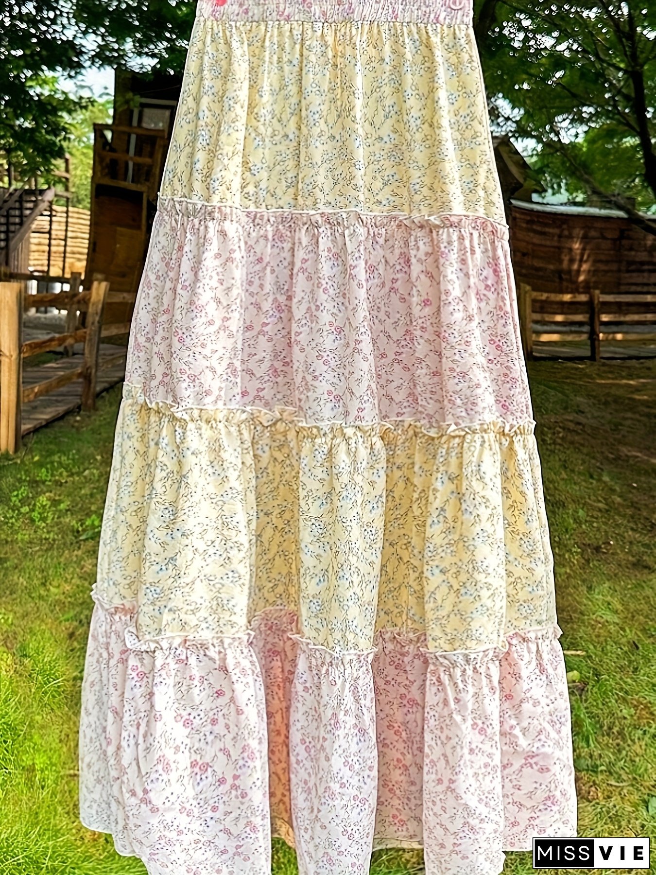 Women&lsquo;s Bohemian Floral Print A-Line Long Skirt with High Waist, Elastic Layered Design, And Flowing Ruffled Trim.